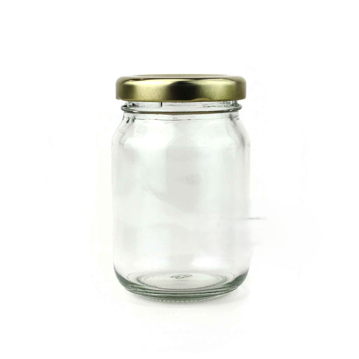 Clear glass jar with a gold lid on a white background