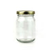 Clear glass jar with a gold lid on a white background