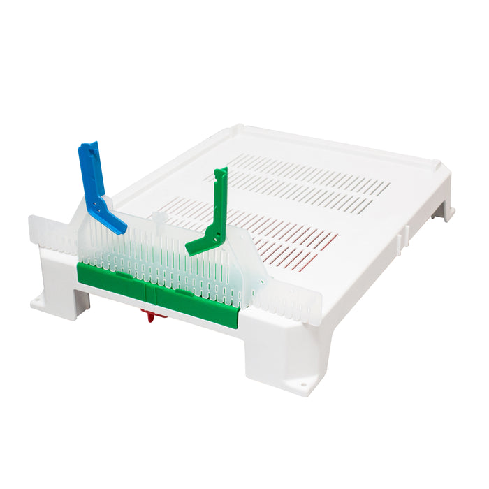 White plastic component with blue and green parts on a white background