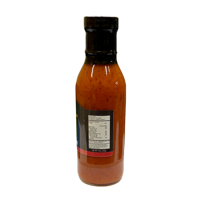 A bottle of red honey french salad dressing with a black cap and a partially visible label, shown against a plain white background.