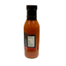 A bottle of red honey french salad dressing with a black cap and a partially visible label, shown against a plain white background.